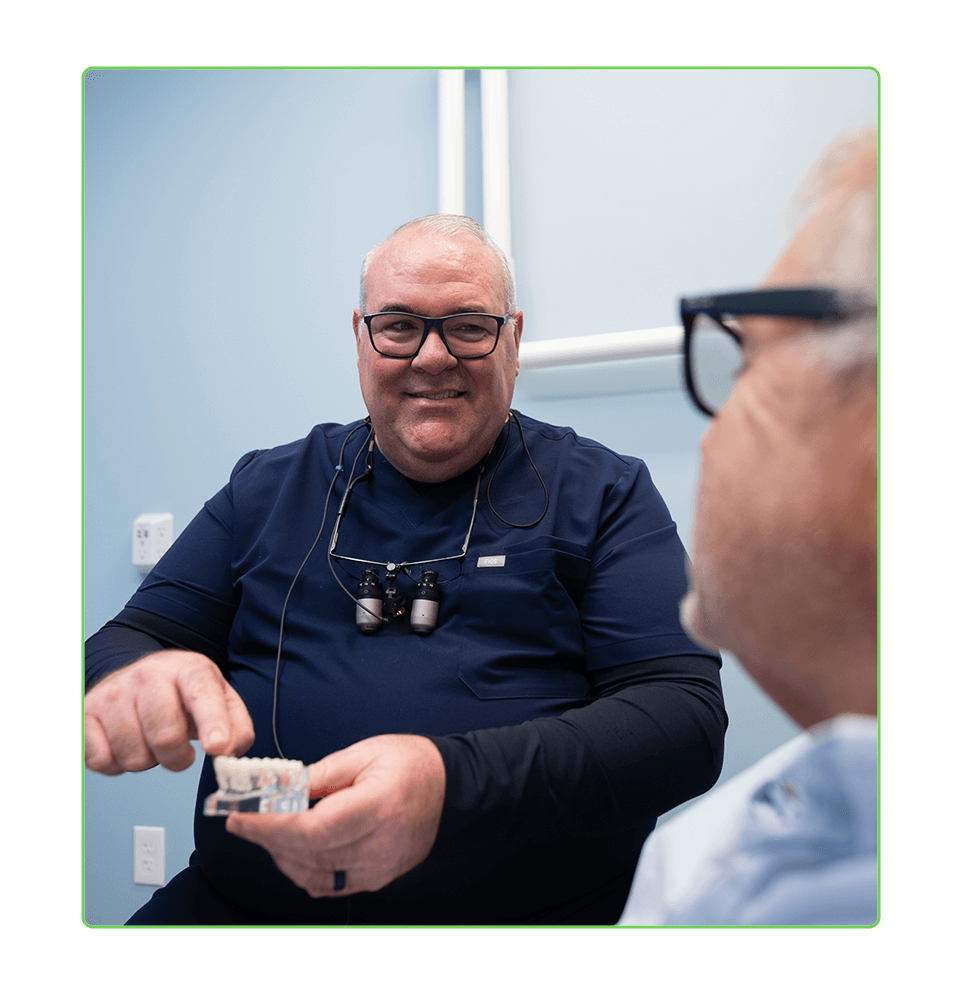 doctor going over dental procedure information with patient