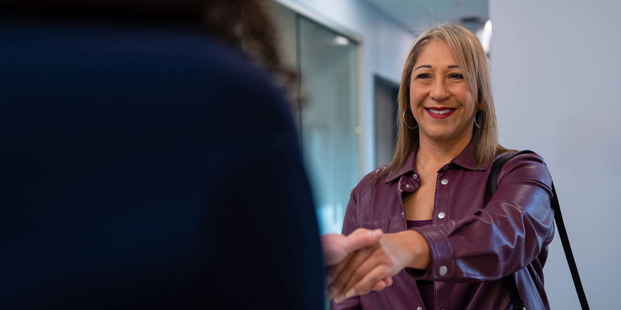 patient being greeted at the front desk of the dental center