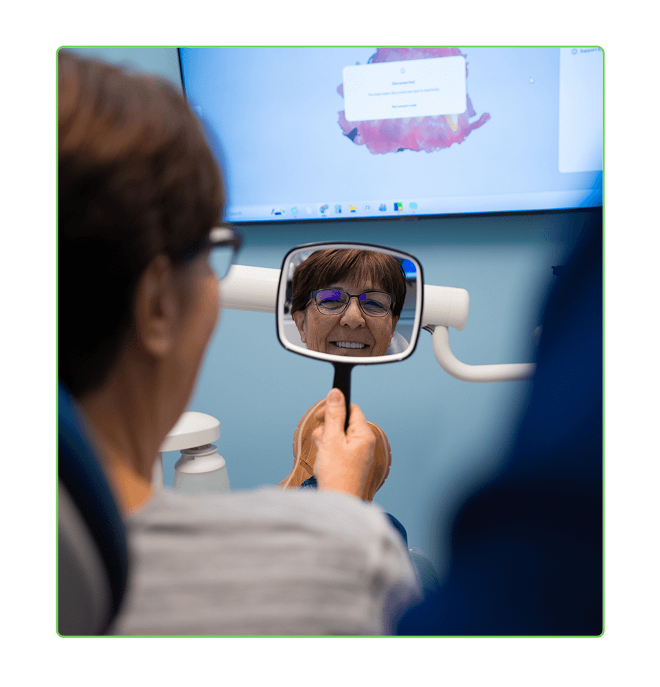 dental patient smiling brightly after their dental treatment within the dental center
