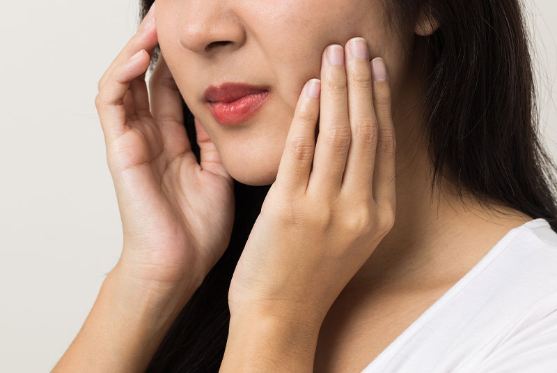 up close shot of person with mouth pain